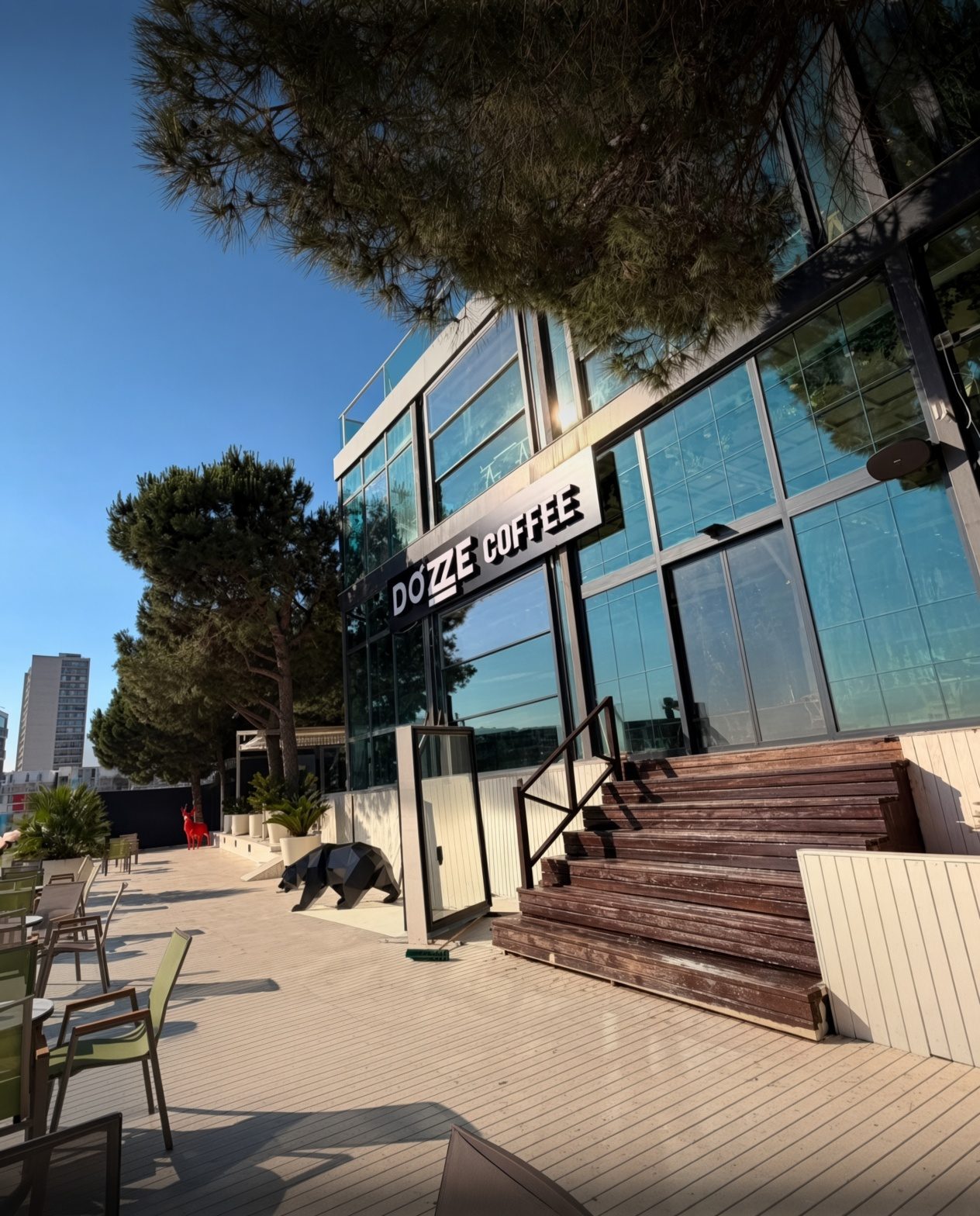 Dozze Coffee glass building and terrace at Atapark