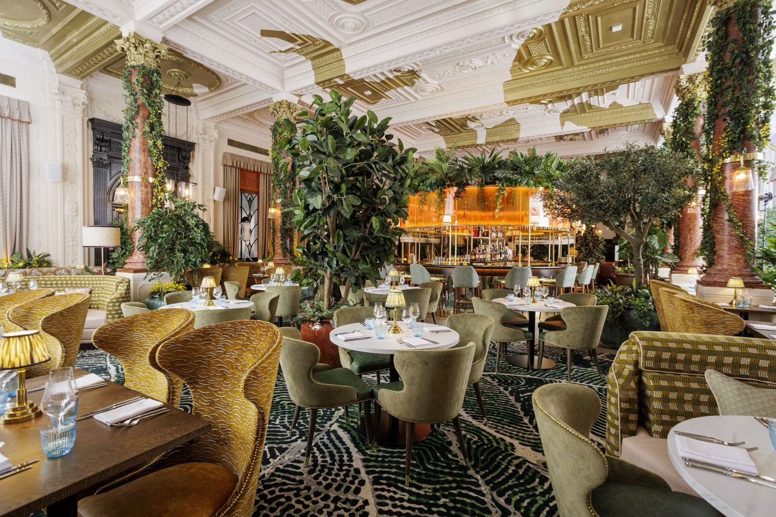 The 300-cover dining room at Idalia, marble columns and a garden of tables