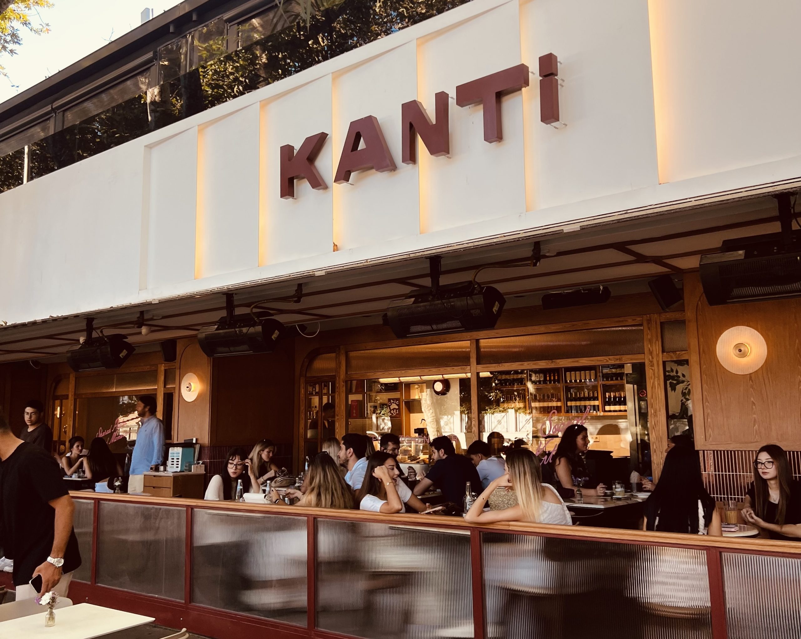 Garden tables and the Kanti sign on Köybaşı Caddesi, Yeniköy