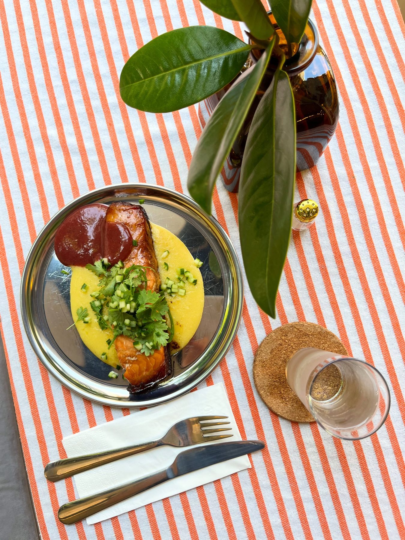 Tables at Tas Lokanta, striped cloth and a daily plate